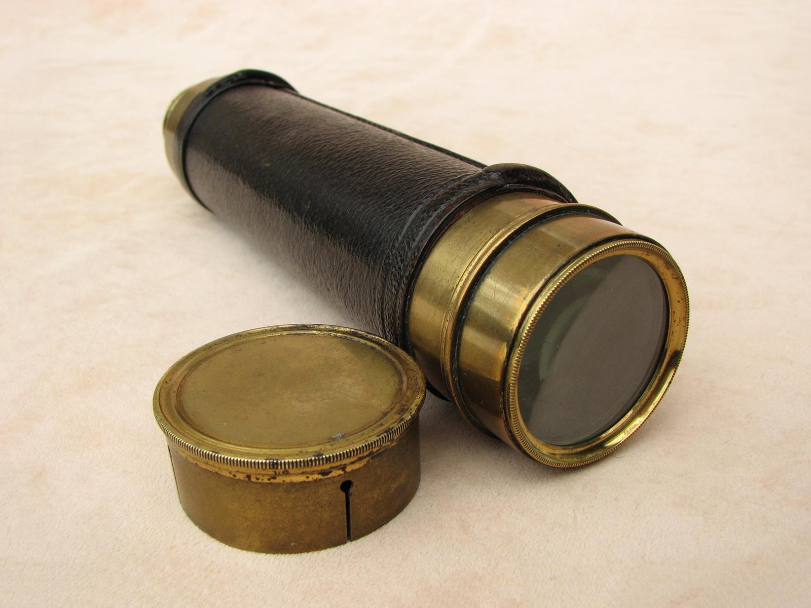 Frederick Cox mid 19th century 3 draw leather clad marine telescope.